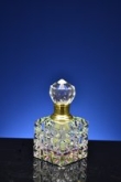 Luxe Kristallen Parfumflesje met Gouden Accenten – Elegant en Exclusief Design